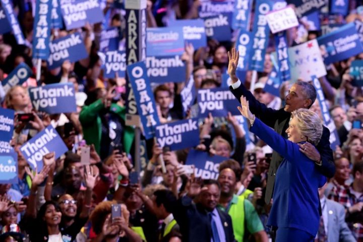 Democratic Party nominee Hillary Clinton joins President Barack Obama on stage at the party convention in Philadelphia