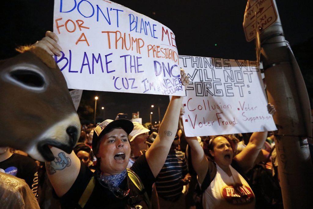 Demonstrators yell during protest at Franklin Delano Roosevelt park in Philadelphia Thursday