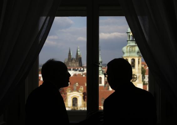 Czech Republic's foreign minister Lubomir Zaoralek right and Iran's vice president and nuclear chief Ali Akbar Salehi look out at Prague's cityscape after a press conference in Prague Czech Republic Monday