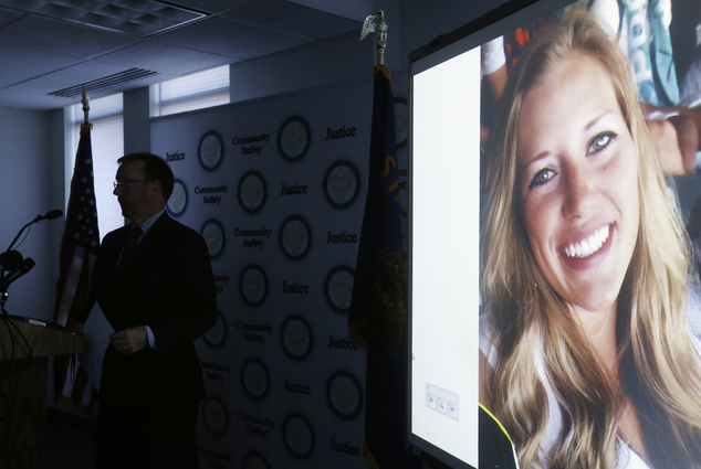 Kaylee Sawyer is displayed on a screen as Deschutes County District Attorney John Hummel speaks during a press conference on Tues