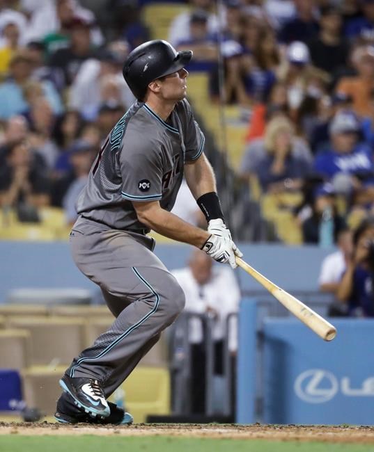 Arizona Diamondbacks&#39 Paul Goldschmidt watches his three-run double during the seventh inning of a baseball game against the Los Angeles Dodgers Friday