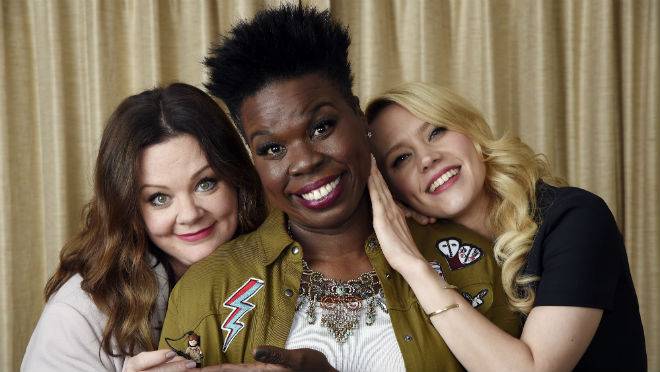 Melissa McCarthy left Leslie Jones center and Kate McKinnon cast members in'Ghostbusters' pose with a Lego toy figure representing fellow cast member Kristen Wiig during a portrait session at the Four Seasons Hotel in Los Angeles