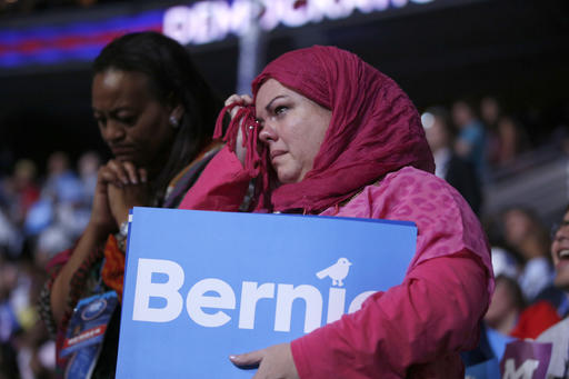 Ohio delegates Cynthia Cox deBoutinkhar right cries as Former Democratic Presidential candidate Sen. Bernie Sanders I-Vt. speaks during the first day of the Democratic National Convention in Philadelphia, Monday July 25