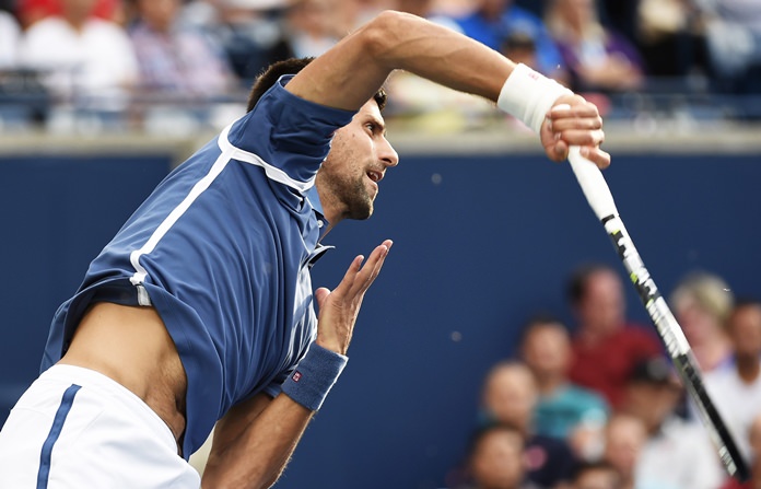 Novak Djokovic of Serbia serves against Tomas Berdych of the Czech Republic at the Rogers Cup tennis tournament Friday July 29 in Toronto