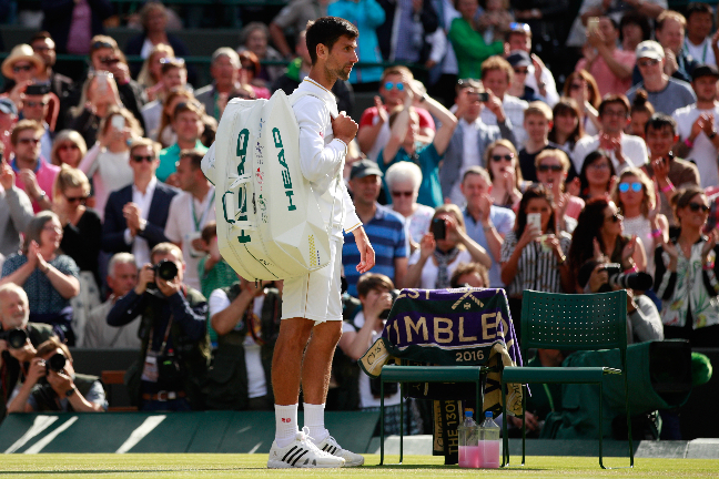 Djokovic looks dejected after his early exit from Wimbledon