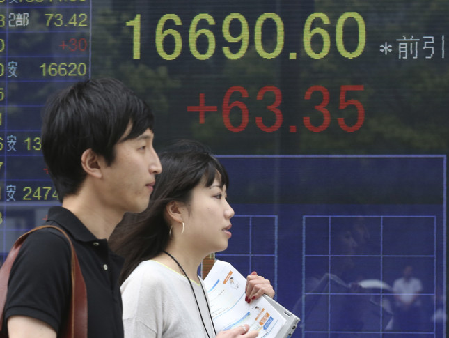 Asian shares trade near nine-month peak, dollar strong