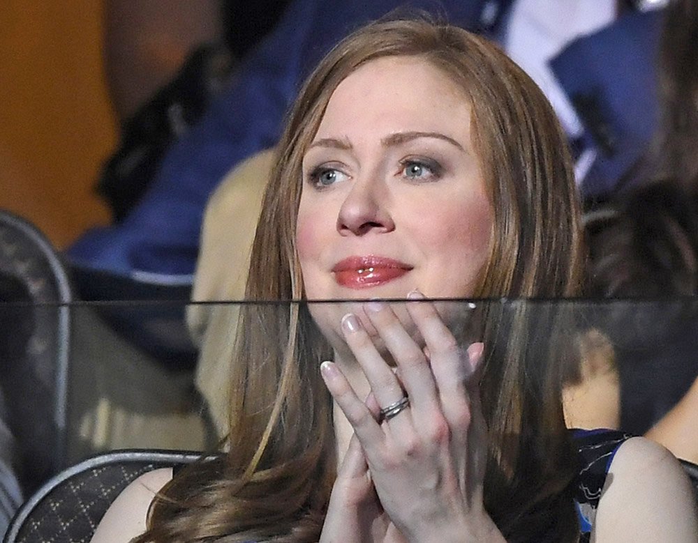 Chelsea Clinton watches the proceedings on Day 2 of the Democratic National Convention in Philadelphia Tuesday. She has spent most of her life in the public eye moving to the White House at the age of 12 after her father was elected in 1992 and heading