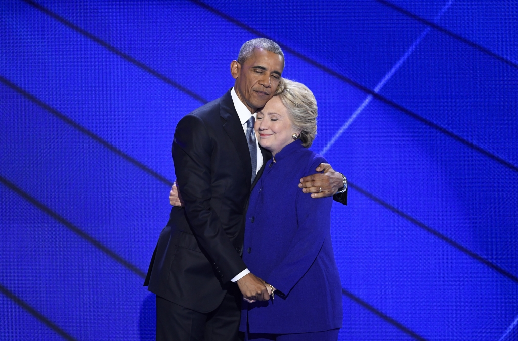 U.S. President Barack Obama hugs Hillary Clinton 2016 Democratic presidential nominee on stage during the Democratic National Convention in Philadelphia Pennsylvania U.S. on Wednesday