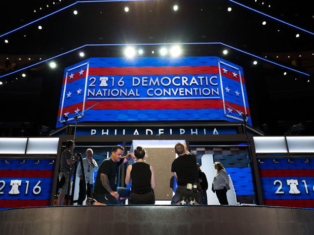 Workers prepare the podium on July 24 ahead of the Democratic National Convention at the Wells Fargo Center in Philadelphia Penn