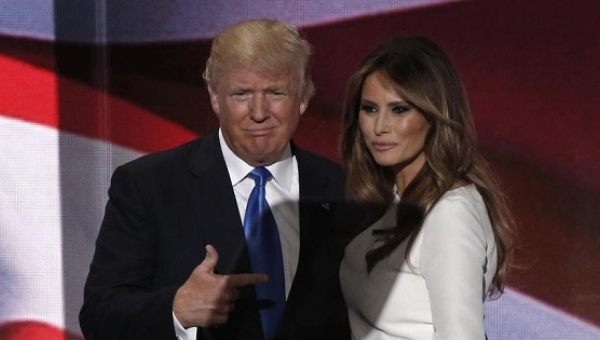 Donald Trump gestures at his wife Melania after she concluded her remarks