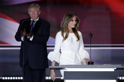 Melania Trump wife of Republican Presidential Candidate Donald Trump walks to the stage as Donald Trump applaudss during the opening day of the Republican National Convention in Cleveland Monday