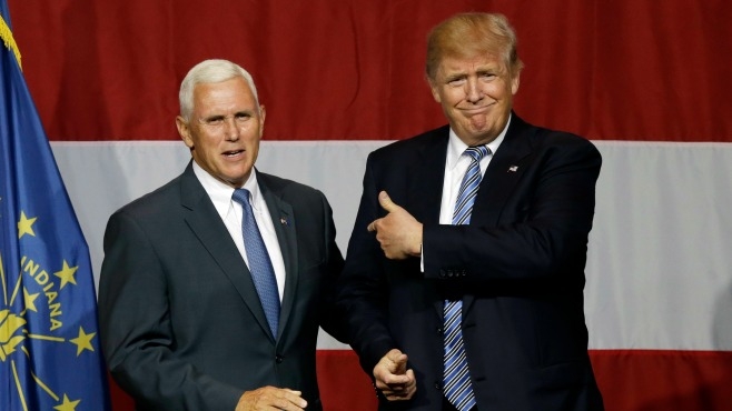 Indiana Gov. Mike Pence joins Republican presidential candidate Donald Trump at a rally in Westfield Ind. Tuesday