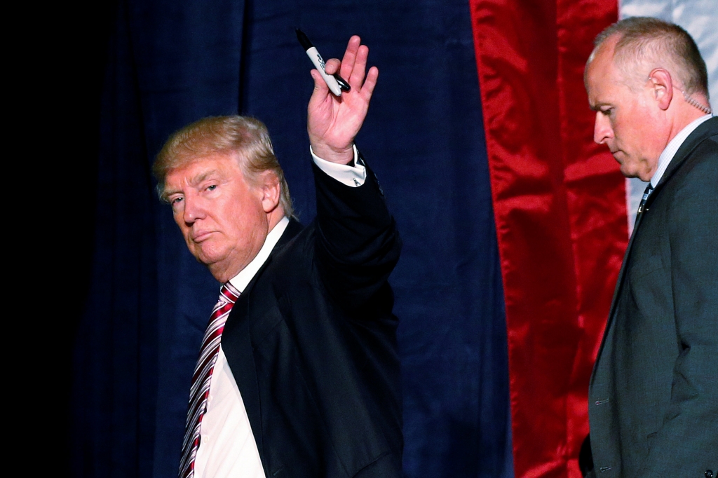 Donald Trump waves after a rally in Toledo Ohio on Wednesday. Carlo Allegri | Reuters