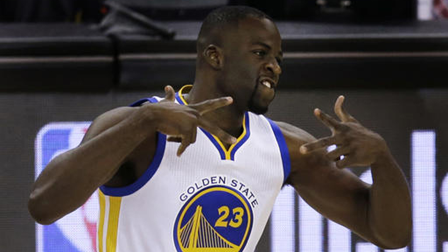 Golden State Warriors&#039 Draymond Green celebrates a score against the Houston Rockets during the first half in Game 5 of a first-round NBA basketball playoff series Wednesday