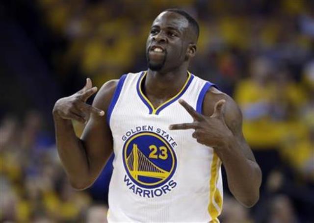 Golden State Warriors&#039 Draymond Green celebrates after scoring against the Houston Rockets during the first half in Game 5 of a first-round NBA basketball playoff series in Oakland Calif. A court conferenc