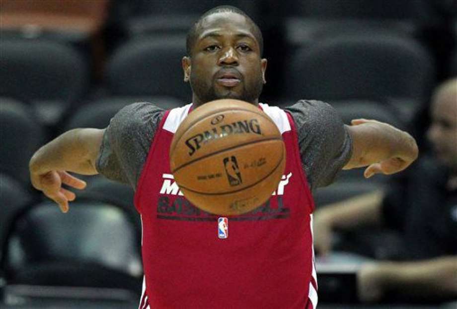 Miami Heat guard Dwyane Wade loosens up during NBA basketball practice in San Antonio. In a decision that essentially started what will become a massive shake-up of the franchise Wade decided Wednesday night Jul