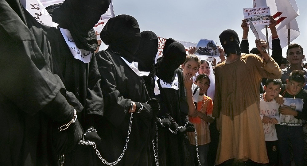 Yazidi Kurds protest against the Islamic State group's invasion on Sinjar city one year ago in Dohuk northern Iraq