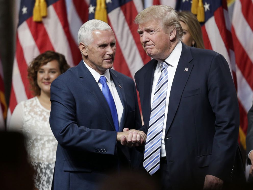 Donald Trump right shakes hands with Indiana Governor Mike Pence after Trump introduced Pence as his vice presidential running mate in New York City