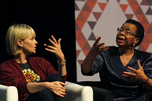 Graca Machel right wife of former president Nelson Mandela makes a point about the rights of young adolescent women as actress Charlize Theron looks at the