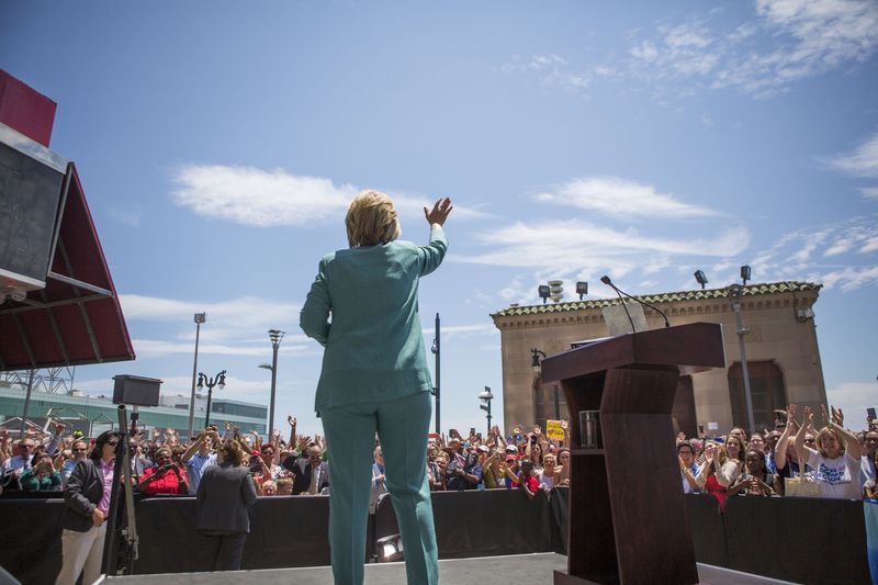 Presumptive Democratic presidential nominee Hillary Clinton waves good-bye to the crowd at a rally on the boardwalk