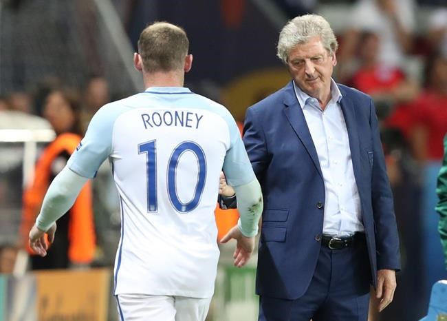 England coach Roy Hodgson salutes Wayne Rooney as he leaves the pitch to be replaced during the Euro 2016 round of 16 soccer match between England and Iceland at the Allianz Riviera stadium in Nice France Monday