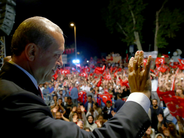 Turkish President Recep Tayyip Erdogan addresses supporters gathered in front of his residence in Istanbul on Tuesday