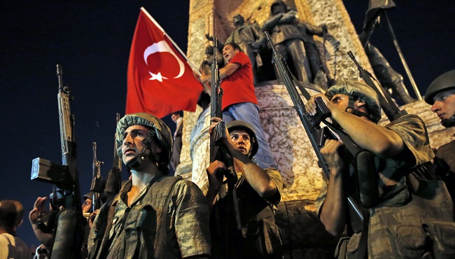 Turkish soldiers secure the area as supporters of Turkey's President Recep Tayyip Erdogan protest in Istanbul's Taksim square early Saturday