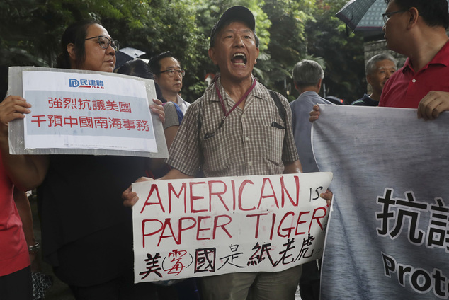 Pro-Beijing protesters shout slogans against the United States supporting an international court ruling of the South China Sea outside the U.S. Consulate