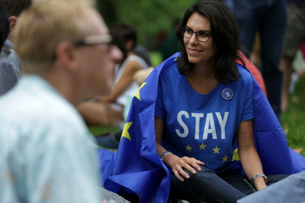 A woman draped in a European flag participates in a picnic against Brexit in London