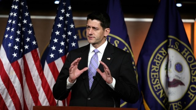 Paul Ryan in front of flags