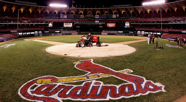 ST. LOUIS- OCTOBER 19 A lawn mower is shown on home plate with a tarp as fans leave the stands following the St. Louis Cardinals 5-1 loss the Houston Astros during Game Six of the National League Championship Series