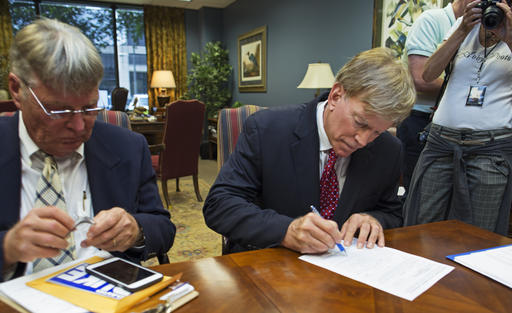 Former Ku Klux Klan leader David Duke registers his candidacy for the November 8 ballot as a Republican at the Louisiana Secretary of State's office in Baton Rouge La. Friday