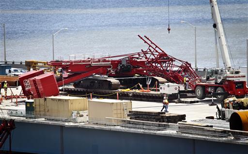 A construction crane is sprawled across lanes in both directions after collapsing on the Tappan Zee Bridge Tuesday