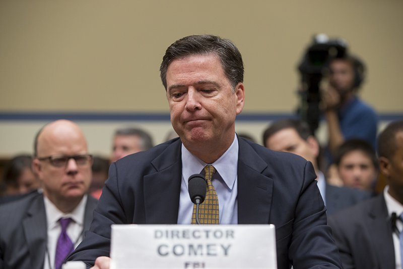 FBI Director James Comey pauses while testifying the House Oversight Committee on Thursday July 7