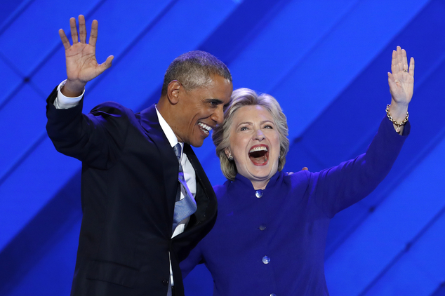 President Barack Obama and Democratic Presidential nominee Hillary Clinton wave to delegates after President Obama's speech during the third day of the Democ