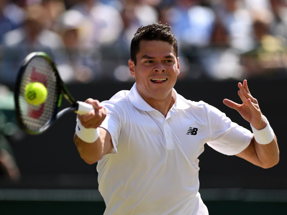 Milos Raonic of Canada plays a forehand during the men's singles quarter-final match against Sam Querrey of the U.S. at Wimbledon