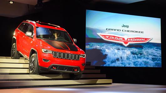 The Chrysler Group LLC Jeep Cherokee Trailhawk sports utility vehicle is driven down stairs on stage during the 2016 New York International Auto Show in New York