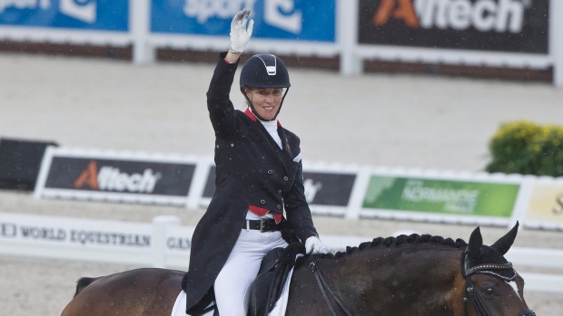 Karen Pavicic riding Don Daiquiri acknowledges applause at the FEI World Equestrian Games in Caen France on Aug. 25 2014. Pavicic claims she was robbed of a chance to compete at the Olympics and blames what she calls the'malicious and'unethical