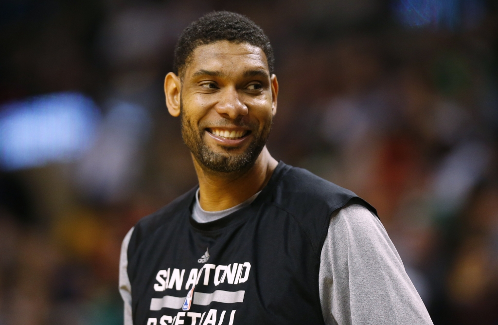 San Antonio Spurs Tim Duncan smiles from the bench during the second half of the San Antonio Spurs 111-89 win over the Boston Celtics in an NBA basketball game in Boston Sunday Nov. 30 2014