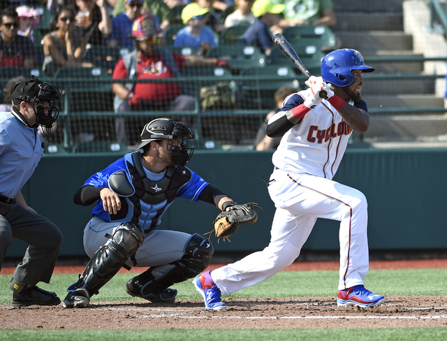 ASSOCIATED PRESS           New York Mets’ Jose Reyes right playing with the Brooklyn Cyclones grounds out as Hudson Valley Renegades’ Daniel De La Calle center catches in the third inning of a minor league baseball game on J