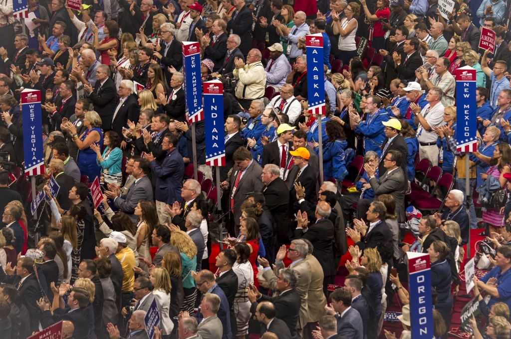 A group of Indiana delegates stand and cheer during a speech made by Pat Smith a Gold Star Mother at the Republican National Convention Monday night. The evening’s theme was “Make America Safe Again” and featured speeches on immigration reform Be