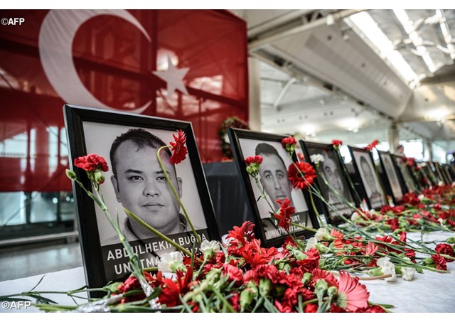 Flowers left in memory of Ataturk airport employees killed in the triple suicide bombing and gun attack on 28 June 2016- AFP