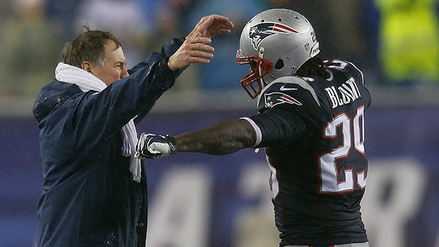 Bill Belichick of the New England Patriots hugs Le Garrette Blount at the end of a win against the Buffalo Bills at Gillette Stadium