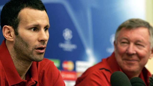 Former Manchester United manager Sir Alex Fergusonas he looks towards midfielder Ryan Giggs during a press conference in Rome