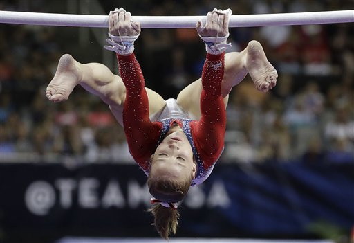 Madison Kocian competes on the uneven bars during the women's U.S. Olympic gymnastics trials in San Jose Calif. Sunday