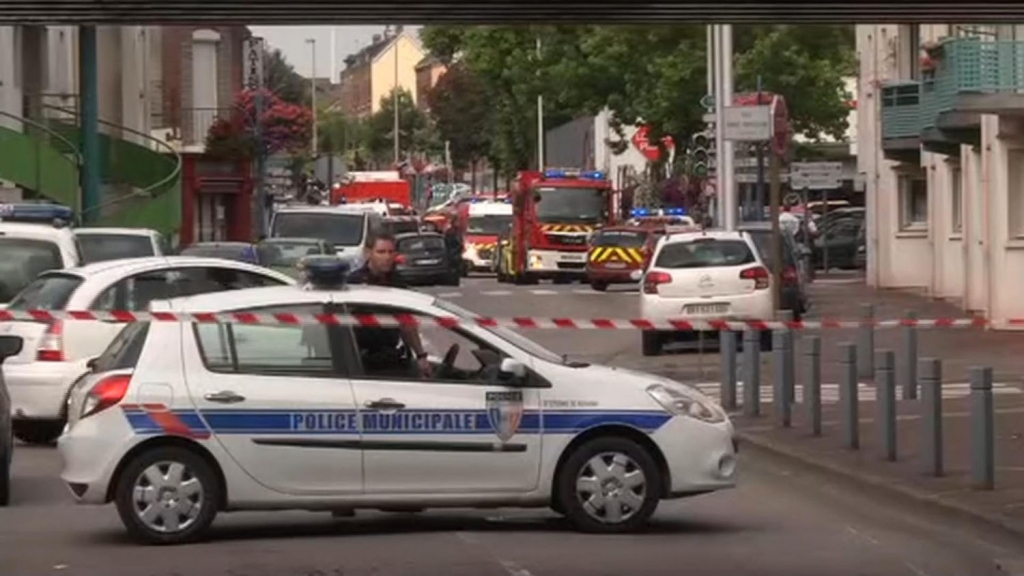 Two attackers seized hostages in a church near the Normandy city of Rouen on Tuesday killing one hostage by slitting