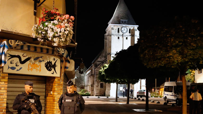 French riot police guards the street to access the church where an hostage taking left a priest dead in Saint-Etienne-du-Rouvray Normandy France Tuesday