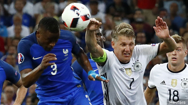 Germany's Bastian Schweinsteiger handles the ball and concedes a penalty