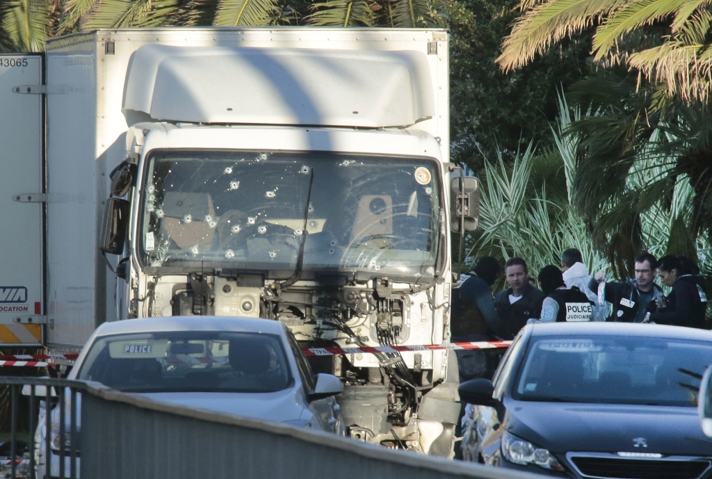 NICE FRANCE- JULY 15 Forensic police investigate a truck at the scene of a terror attack on the Promenade des Anglais