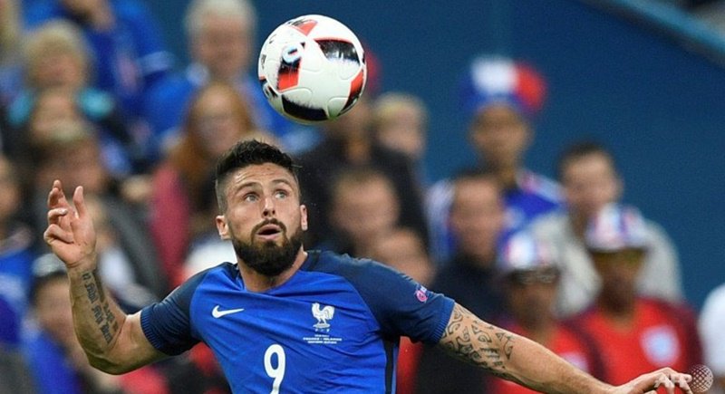 France’s Olivier Giroud heads the ball during the Euro 2016 quarter-final football match between France and Iceland at the Stade de France in Saint-Denis